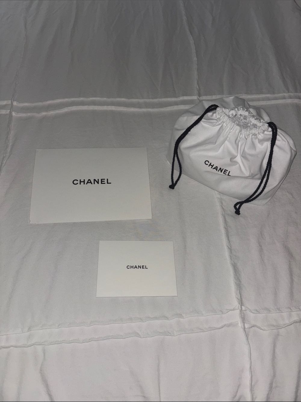 CHANEL White Fabric Drawstring Pouch with Black Cord and Branded Cards